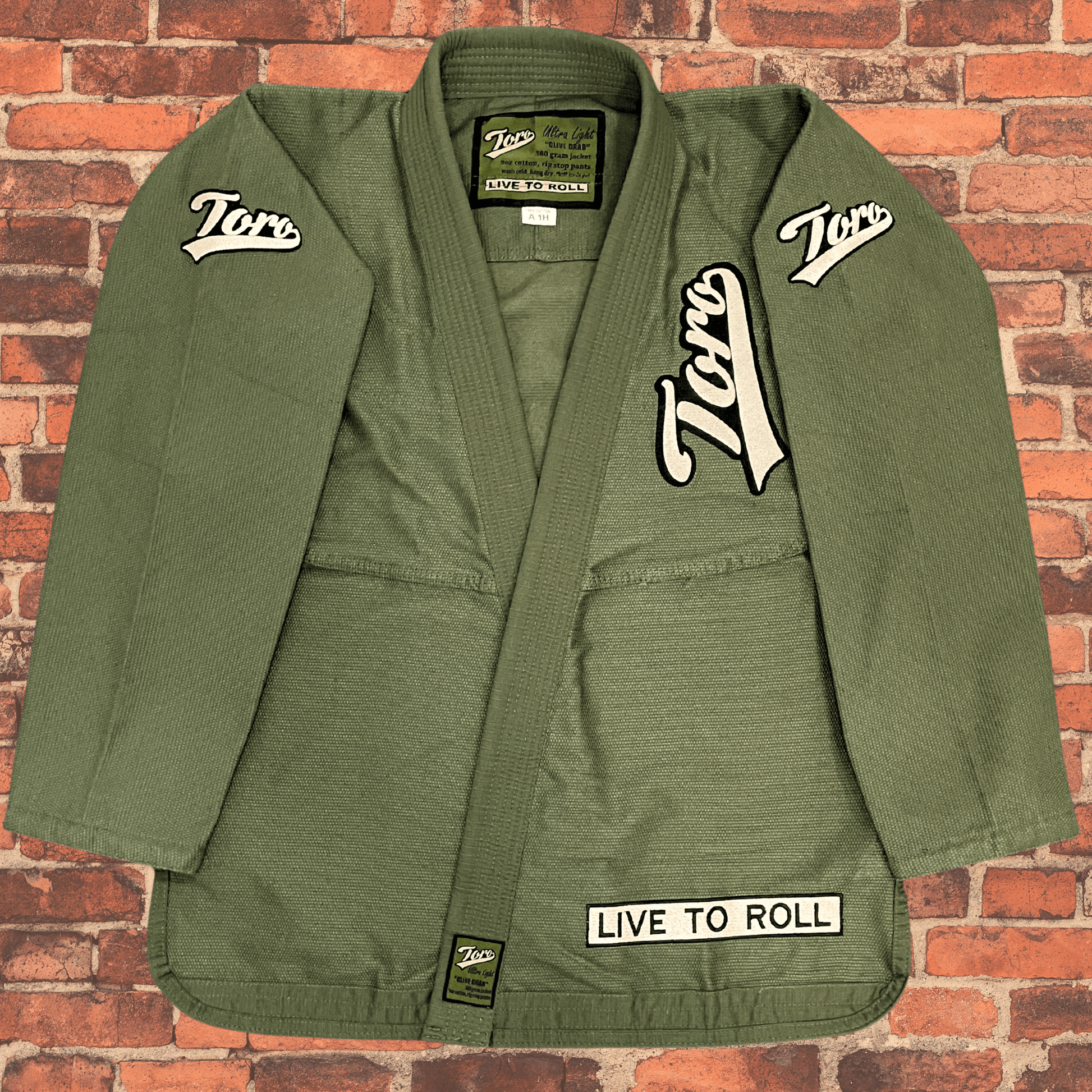 Toro BJJ Olive Drab Ultra Light 380gsm BJJ gi jacket with Toro patches and Live to Roll design