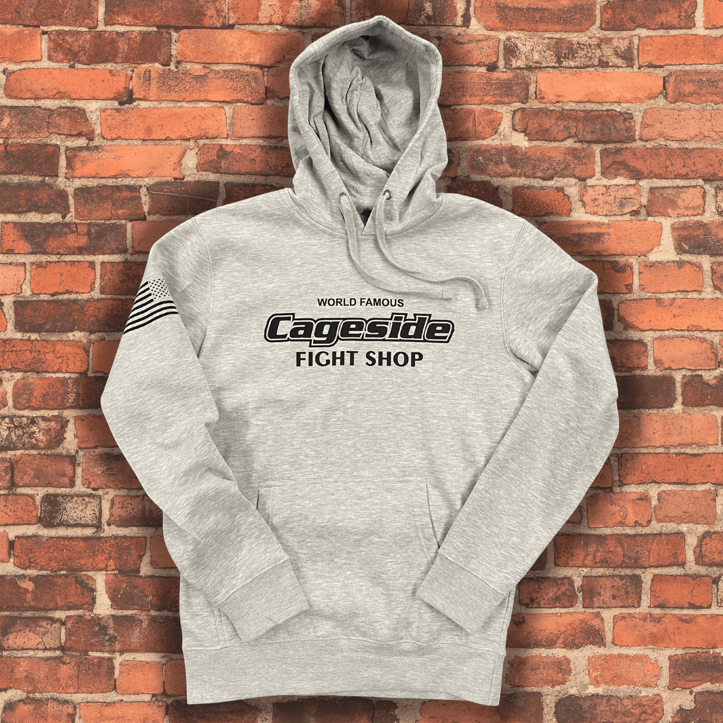 Heather gray Cageside Fight Shop hoodie with front logo print, soft fleece fabric, and jersey-lined hood