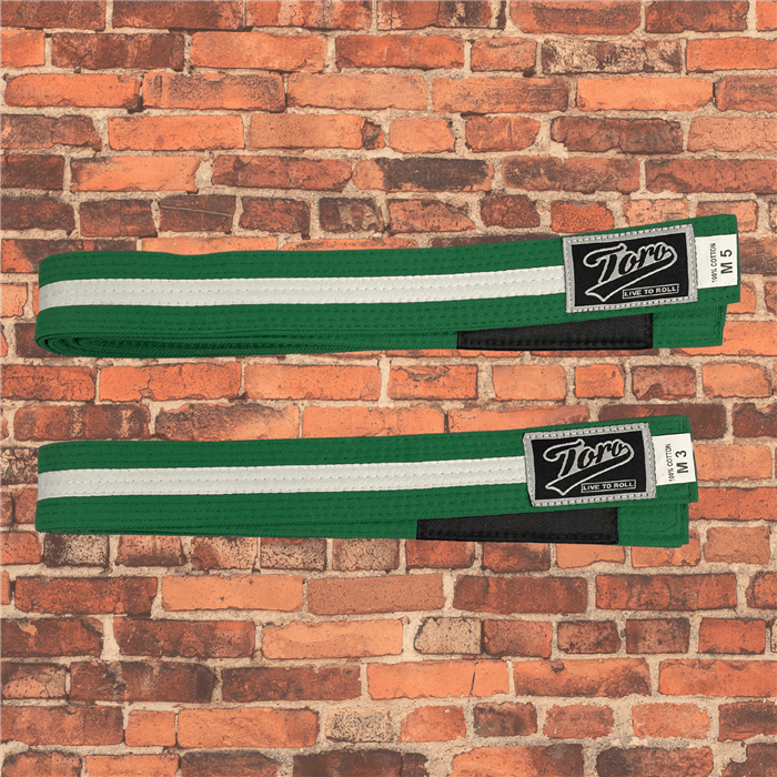 Toro BJJ kids green BJJ belts with white stripe, sizes M000–M5, Toro logo patch with 'Live to Roll' text beneath, black rank bar.