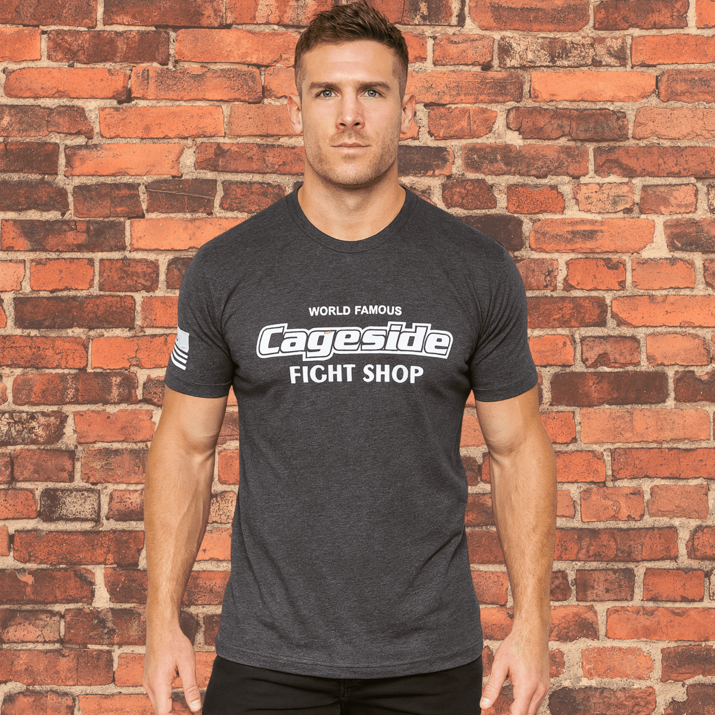 Model wearing charcoal Cageside Fight Shop tri-blend t-shirt showing athletic fit.
