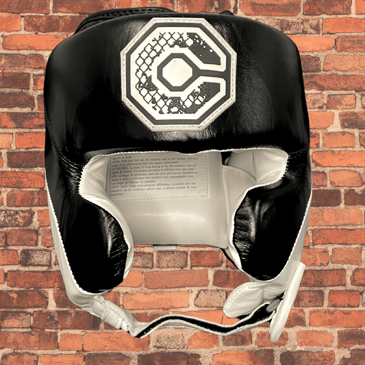 Black and white Cageside Original Defender boxing headgear with open face and padded cheek guards