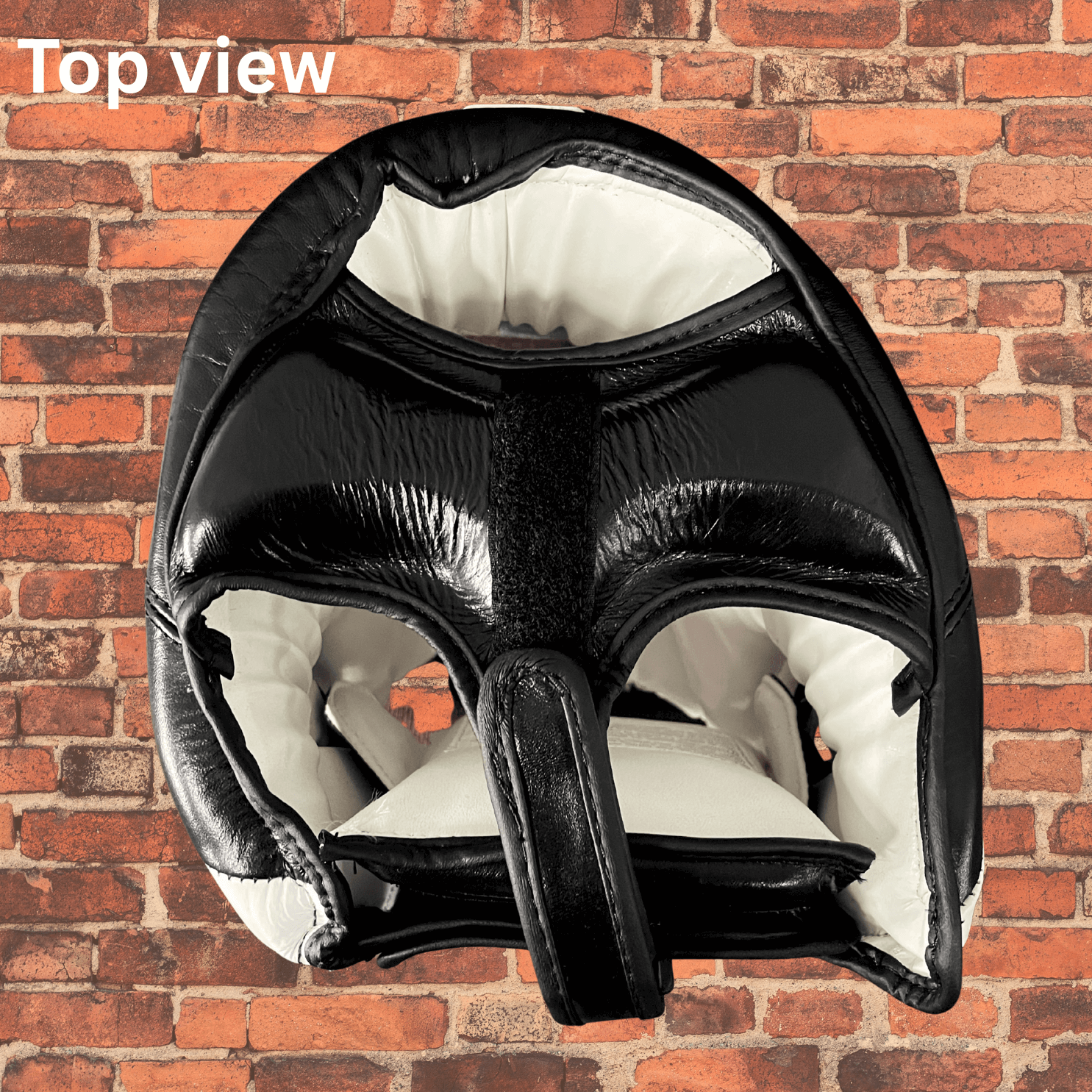 Top view of Cageside leather headgear showing padded crown and adjustable top strap