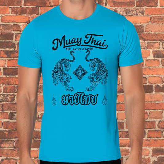 A turquoise tri-blend t-shirt featuring a black Muay Thai design with two symmetrical tigers, a central floral emblem, and "Muay Thai The Art of 8 Limbs" text on a red brick background.