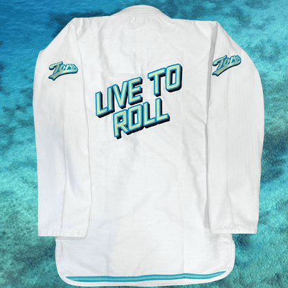 Full back view of white Good Vibes BJJ Gi with large Live to Roll embroidery and Toro shoulder logos