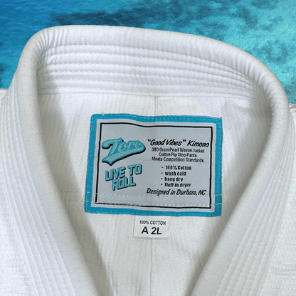Inside collar label of Toro Good Vibes BJJ Gi showing 380 gram pearl weave and 9oz ripstop pants