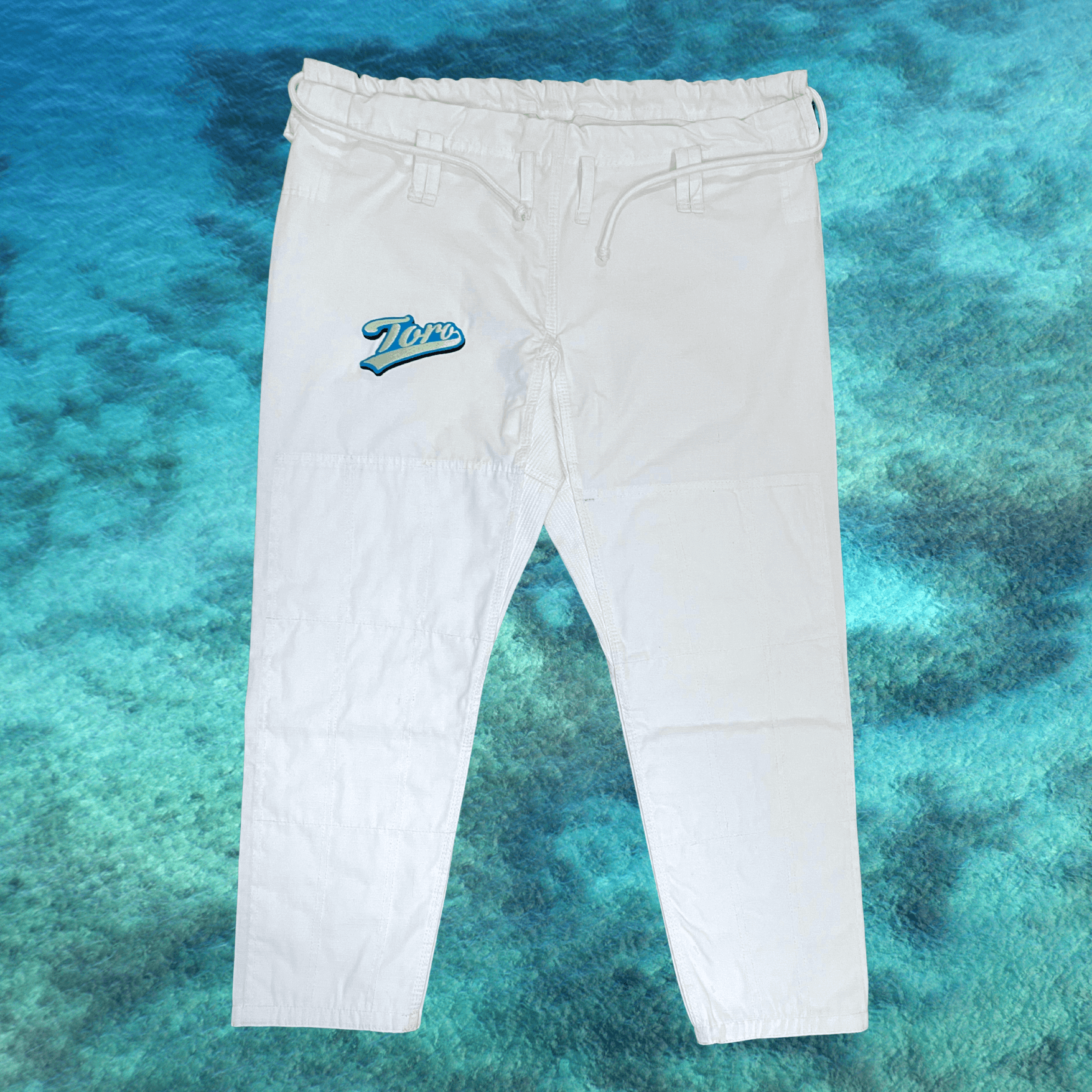 White 9oz ripstop pants from the Toro Good Vibes BJJ Gi with embroidered Toro logo
