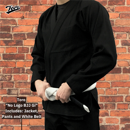 A person wearing a black Toro No Logo BJJ Gi holding a white belt. Includes a jacket, pants, and belt, ideal for BJJ practice and competition.