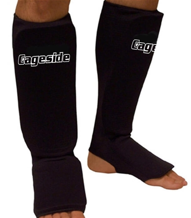 Cageside cloth shin guards worn on legs for training protection