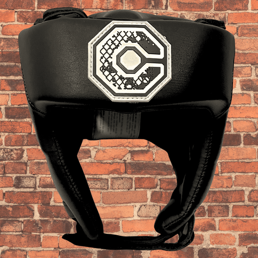 Cageside Competition Headgear front view with Cageside logo on black padding