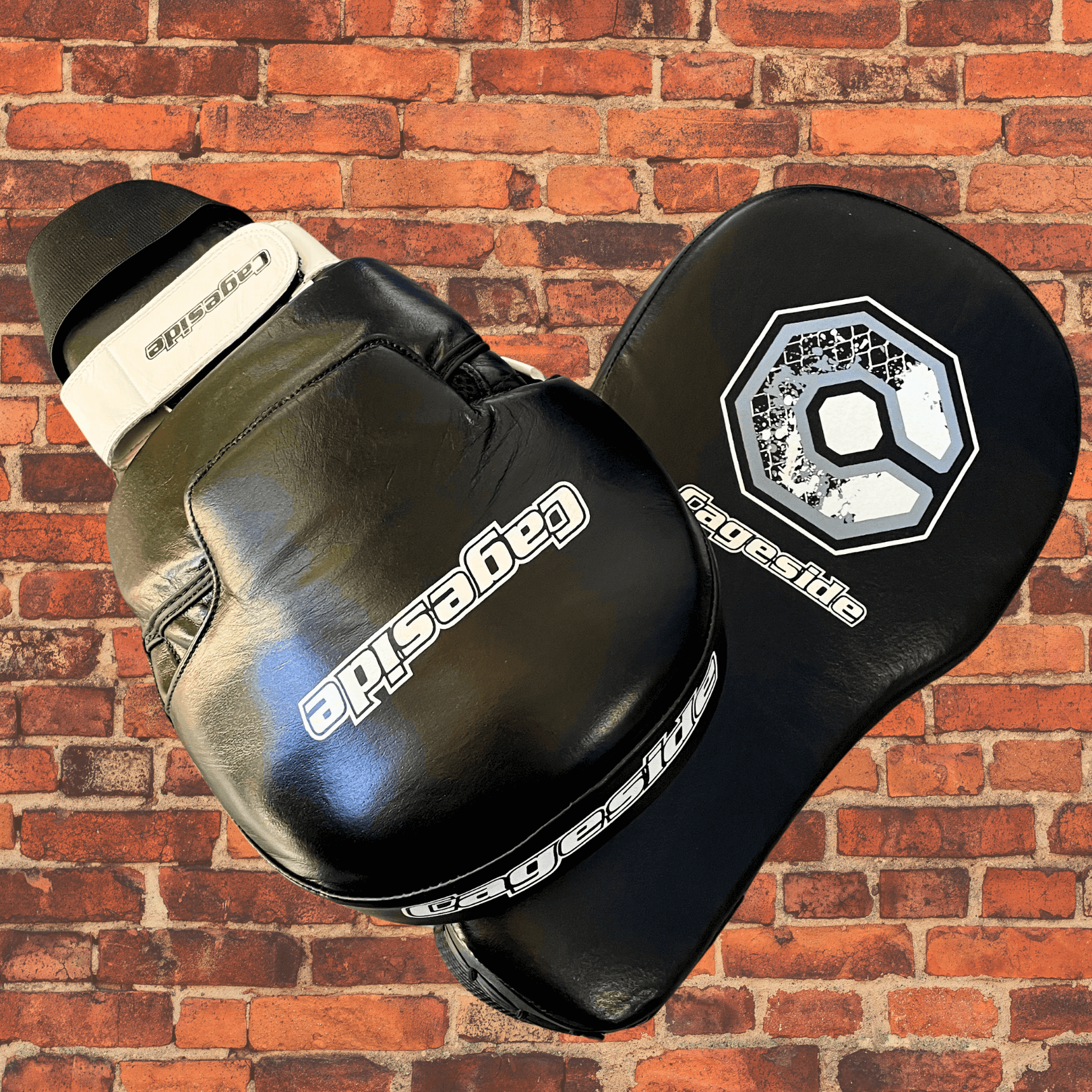 Cageside Hybrid Mega Mitts black leather focus mitts stacked showing front and back logos