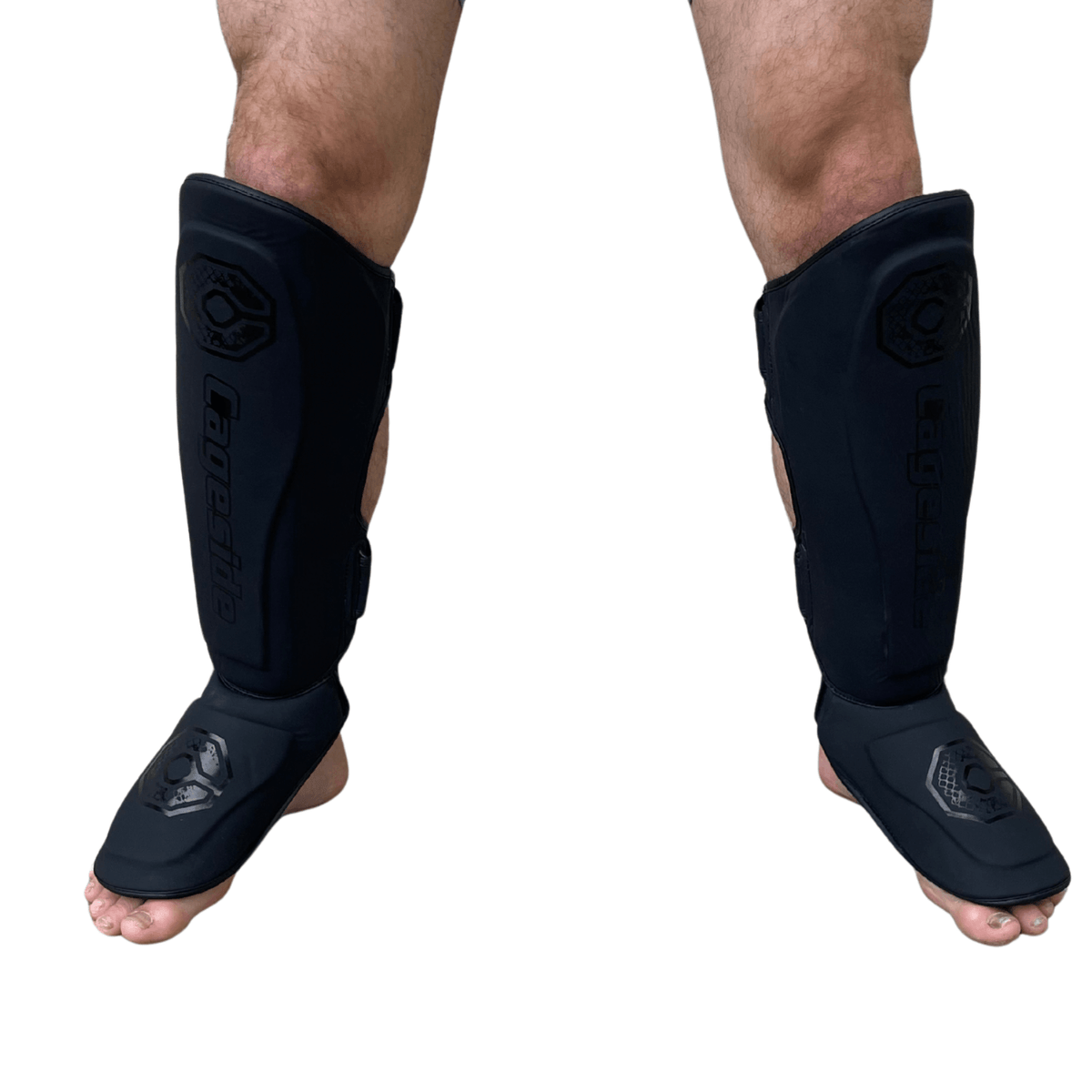 Cageside Steel Carbon Pro Spar Shin Guards worn from the front