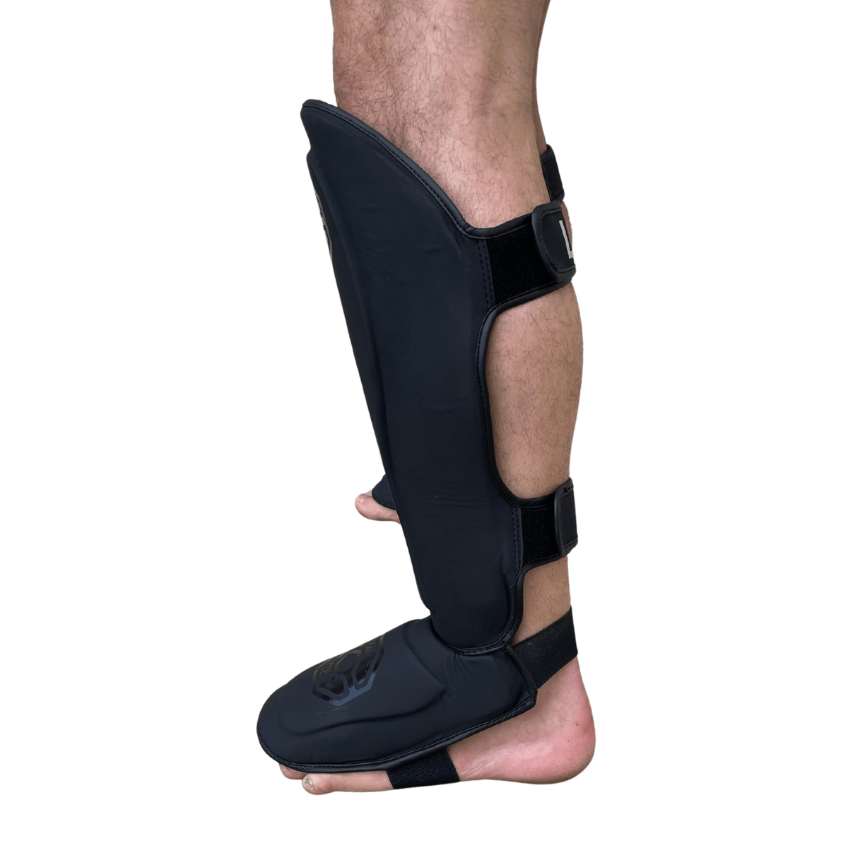 Side view of Cageside Steel Carbon Pro Spar Shin Guard showing shin and foot coverage