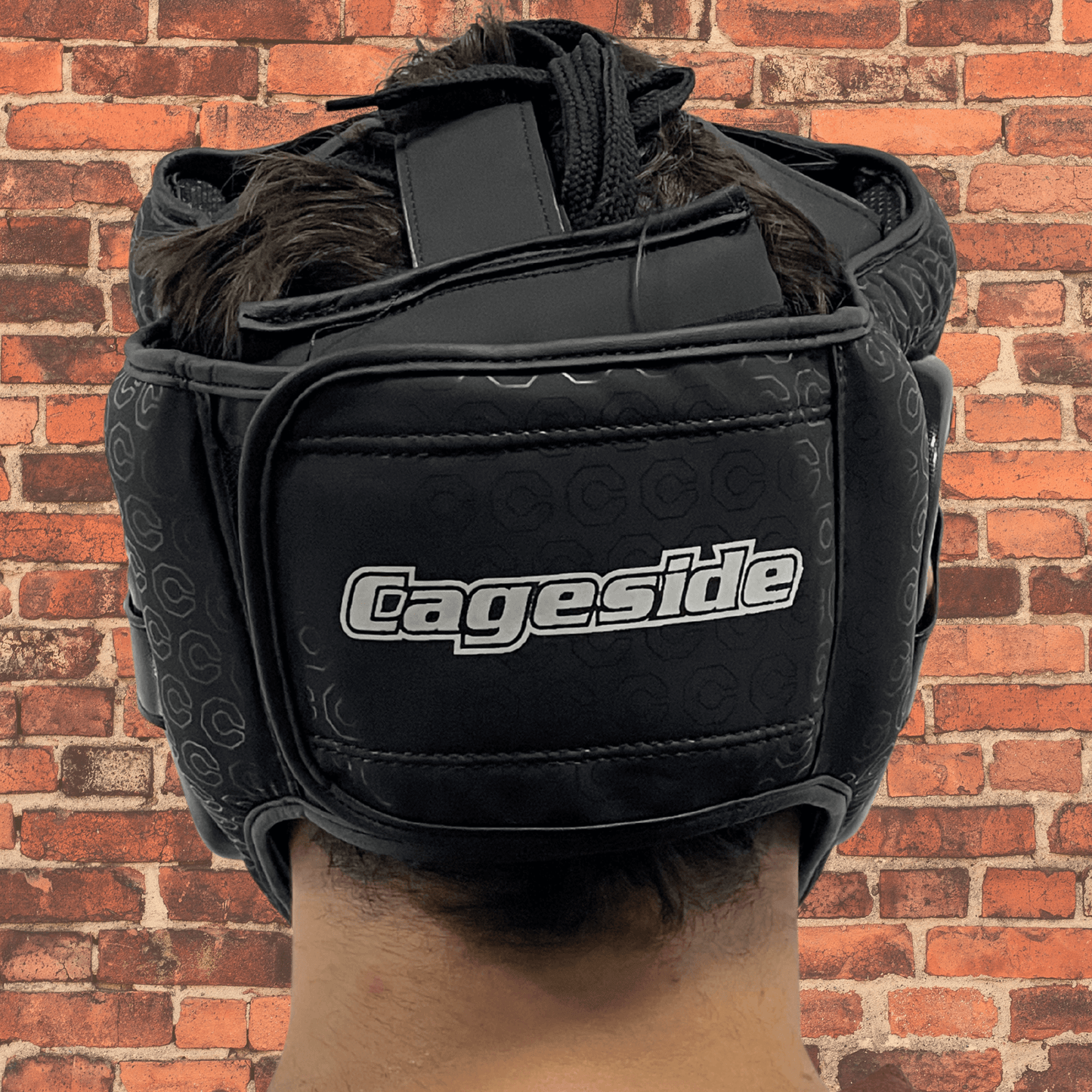 Cageside Full Face Sparring Headgear back view with adjustable closure and Cageside logo