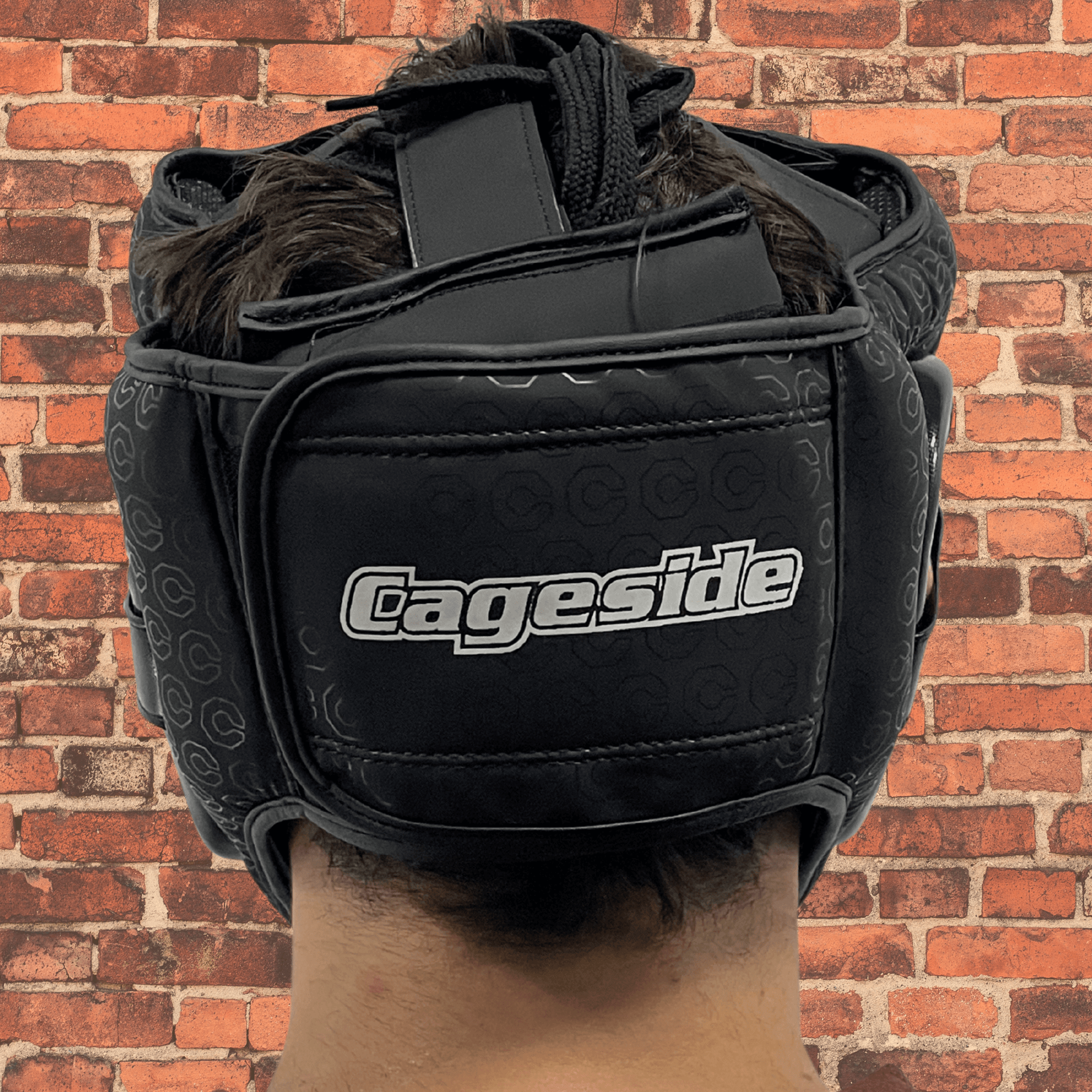 Cageside Full Face Sparring Headgear back view with adjustable closure and Cageside logo