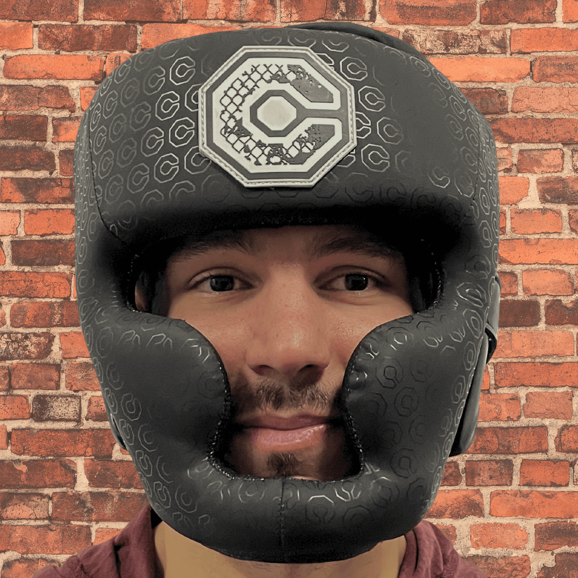 Cageside Full Face Sparring Headgear front view worn by athlete, showing full coverage protection