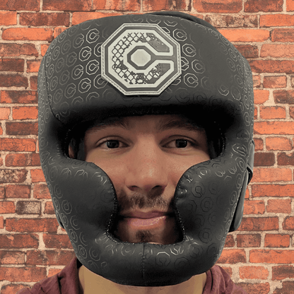 Cageside Full Face Sparring Headgear front view worn by athlete, showing full coverage protection