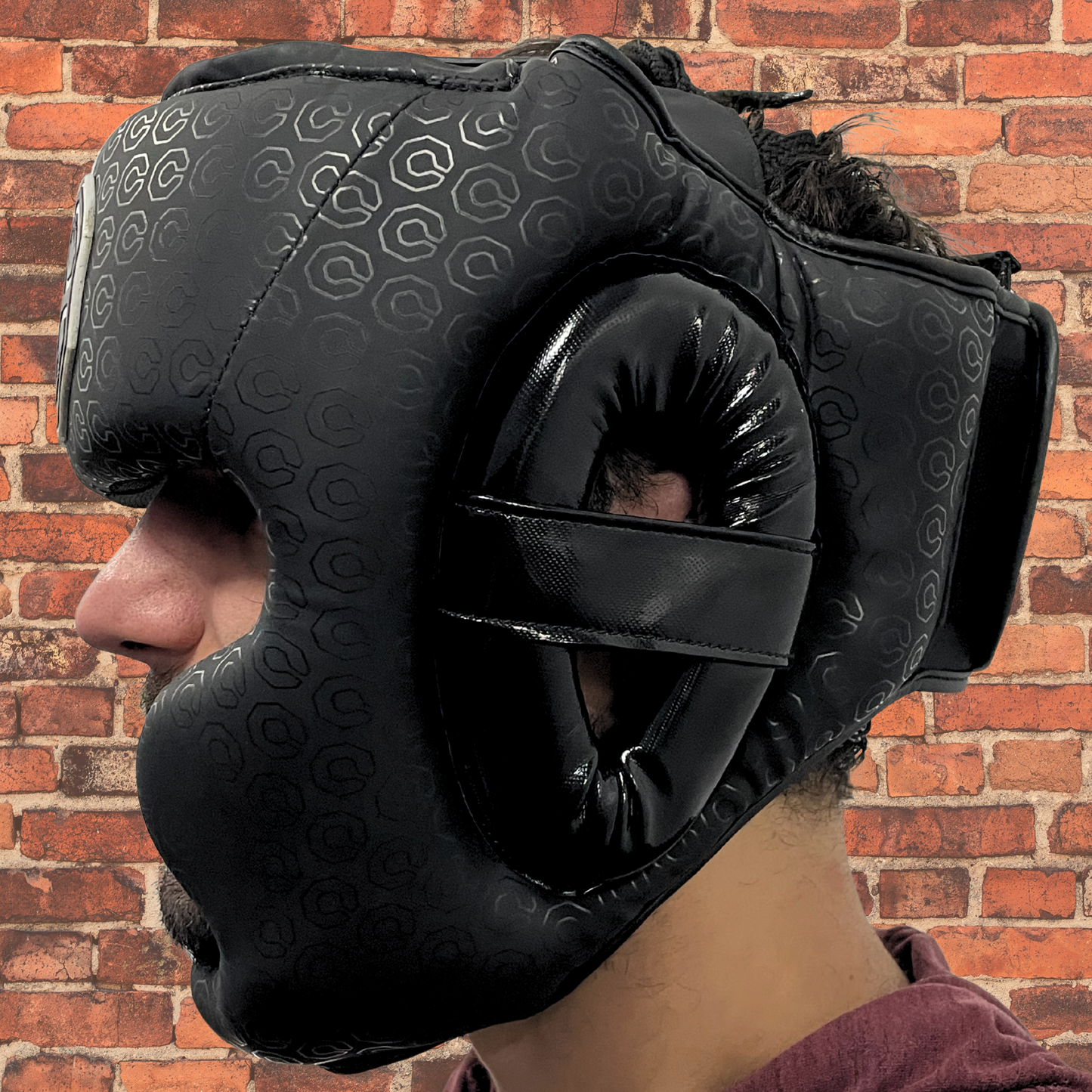 Cageside Full Face Sparring Headgear side profile worn by athlete showing cheek and chin protection