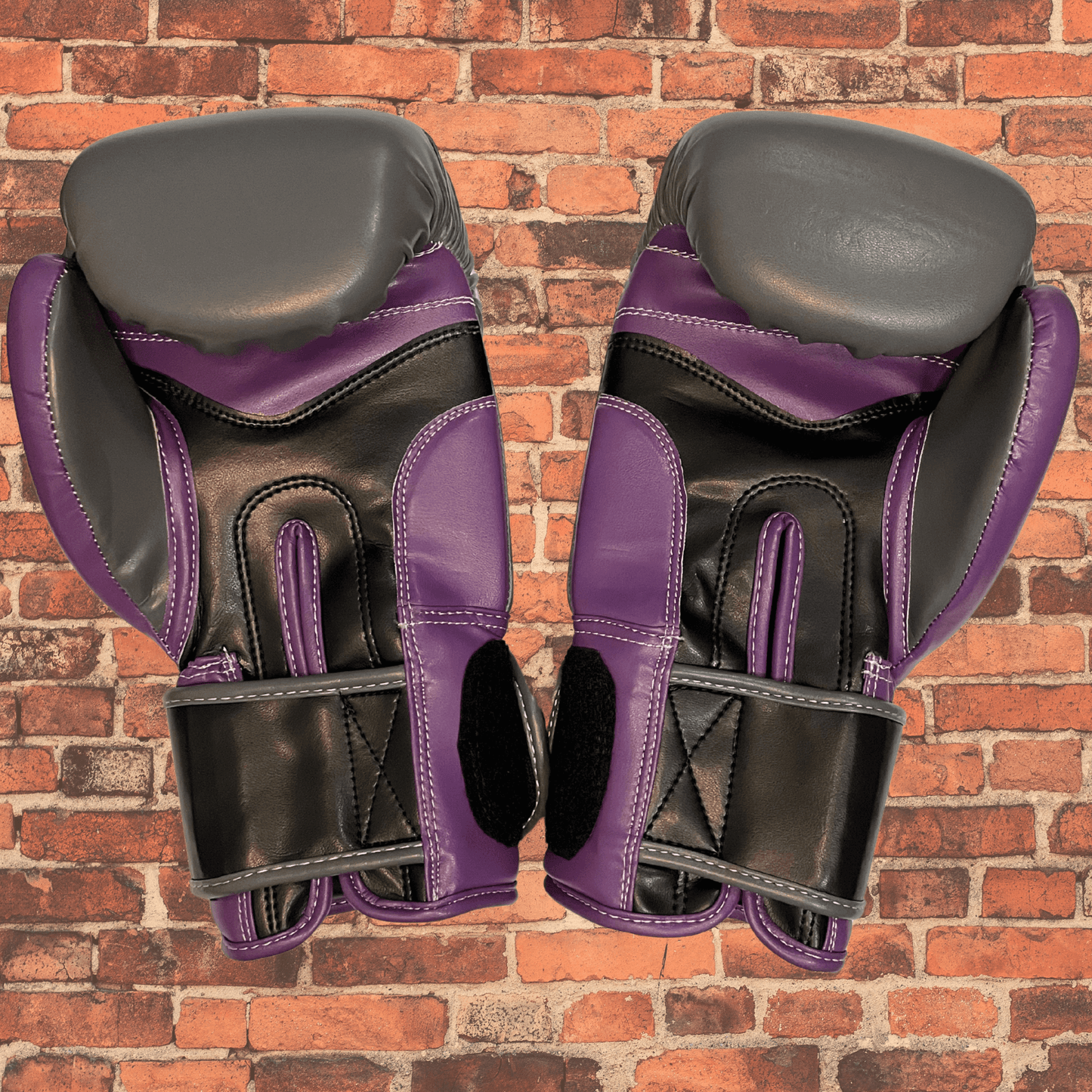 Pair of Cageside Shredder boxing gloves in purple, gray, and black, ideal sparring and bag gloves