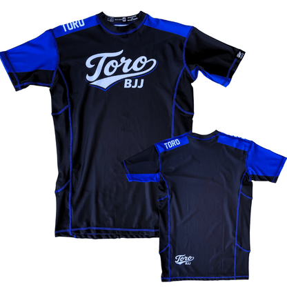 Front and back views of Toro 2027 blue belt ranked short-sleeve rash guard