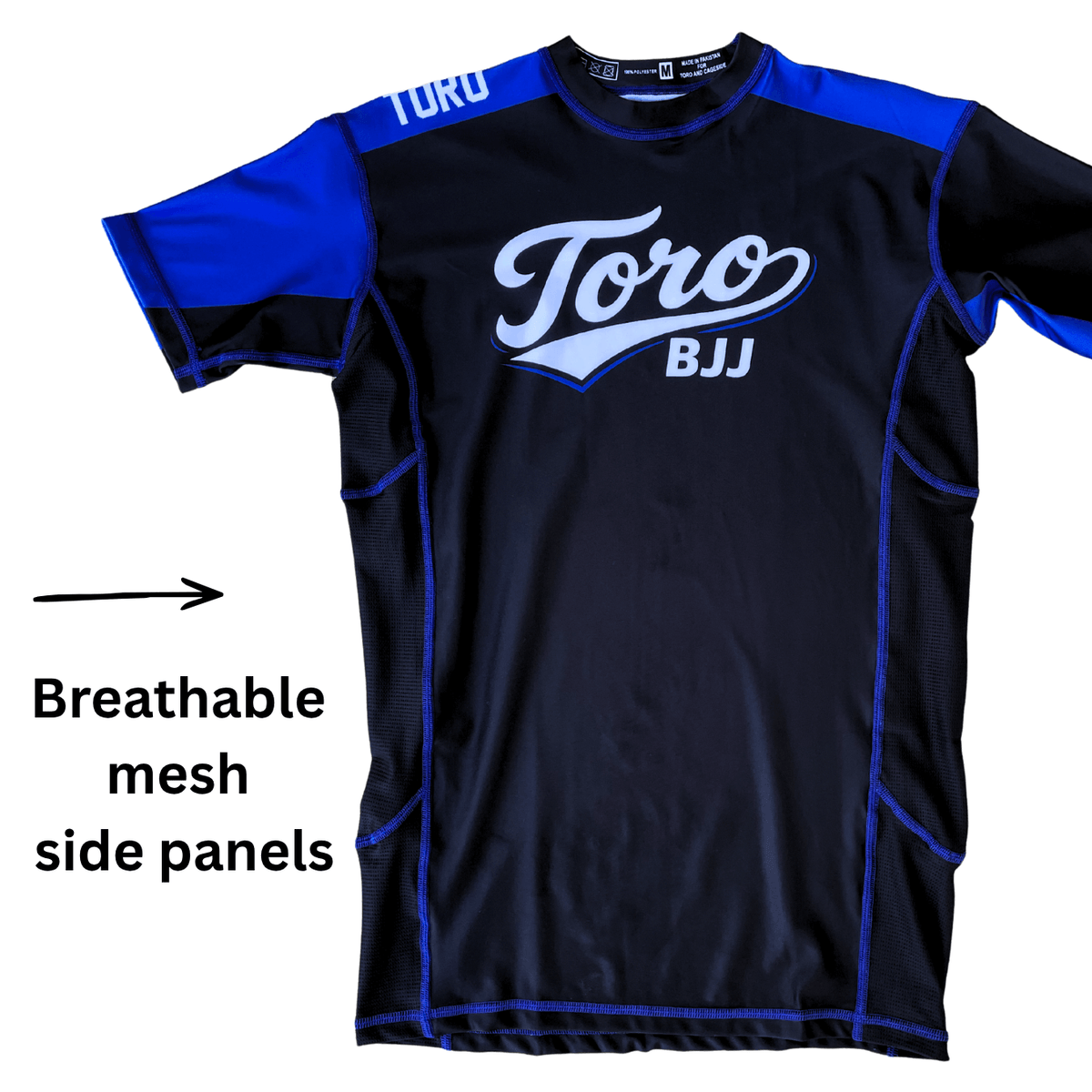 Toro 2027 blue belt rash guard with an arrow highlighting breathable mesh side panels