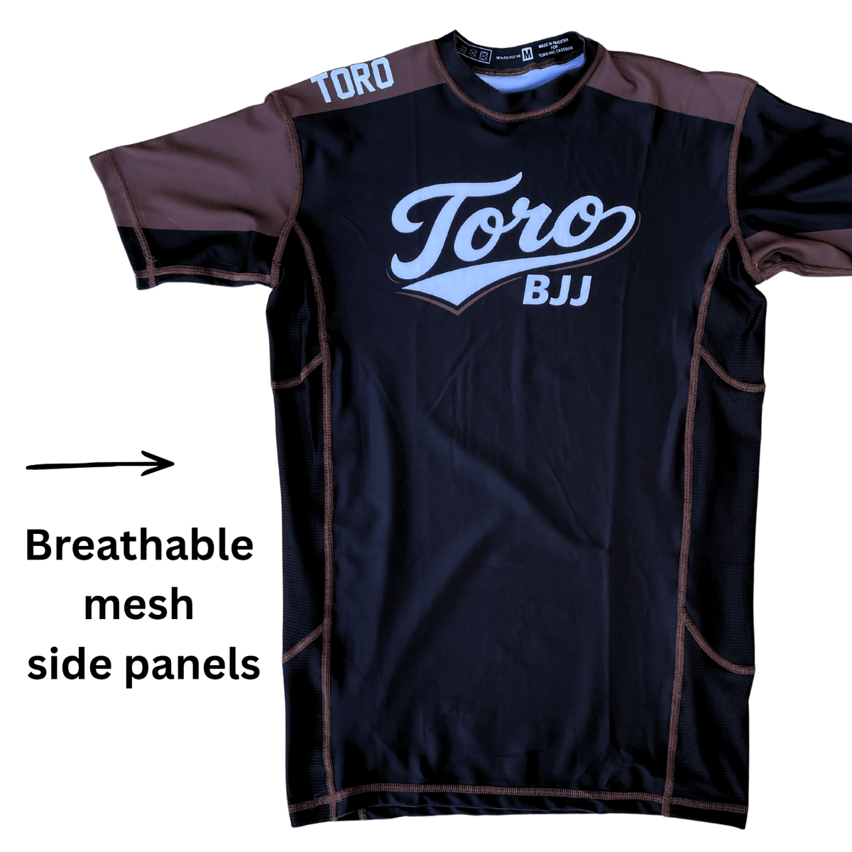 Toro 2027 brown belt rash guard with an arrow highlighting breathable mesh side panels
