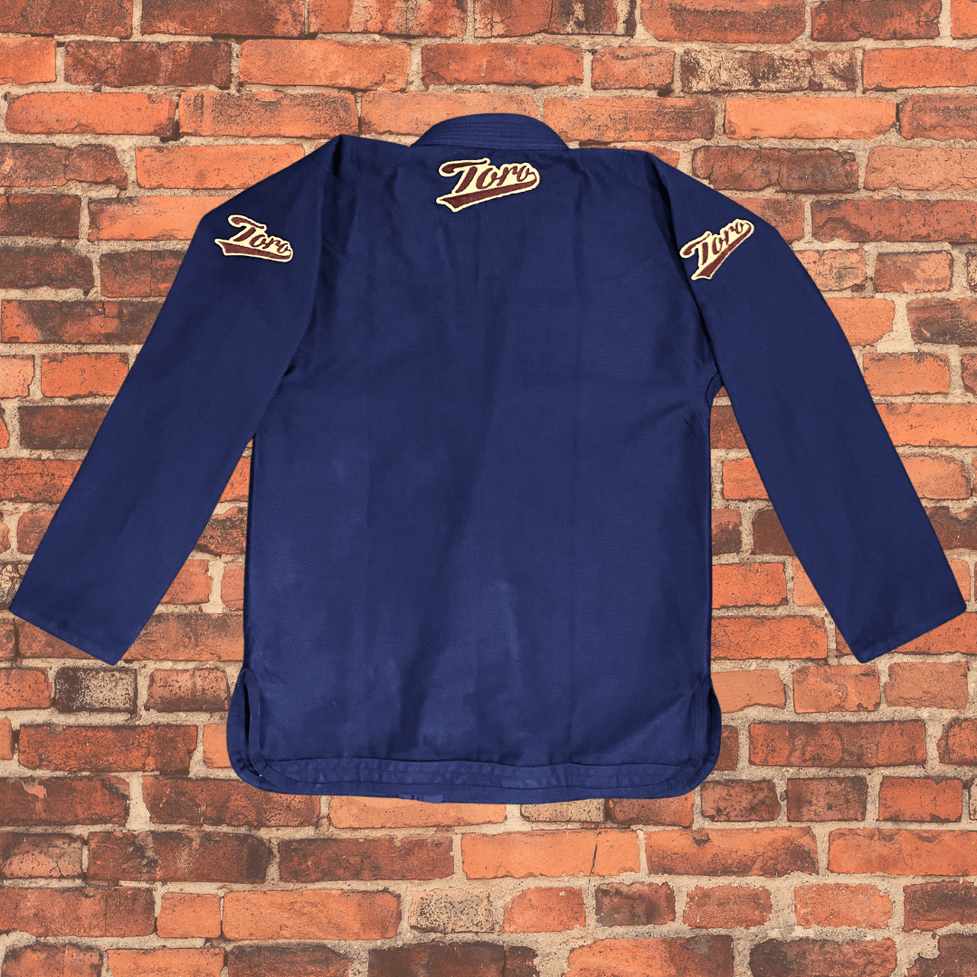 Navy Blue BJJ Gi jacket back view with Toro logos on shoulders and collar, Toro BJJ Coyote Gi limited edition