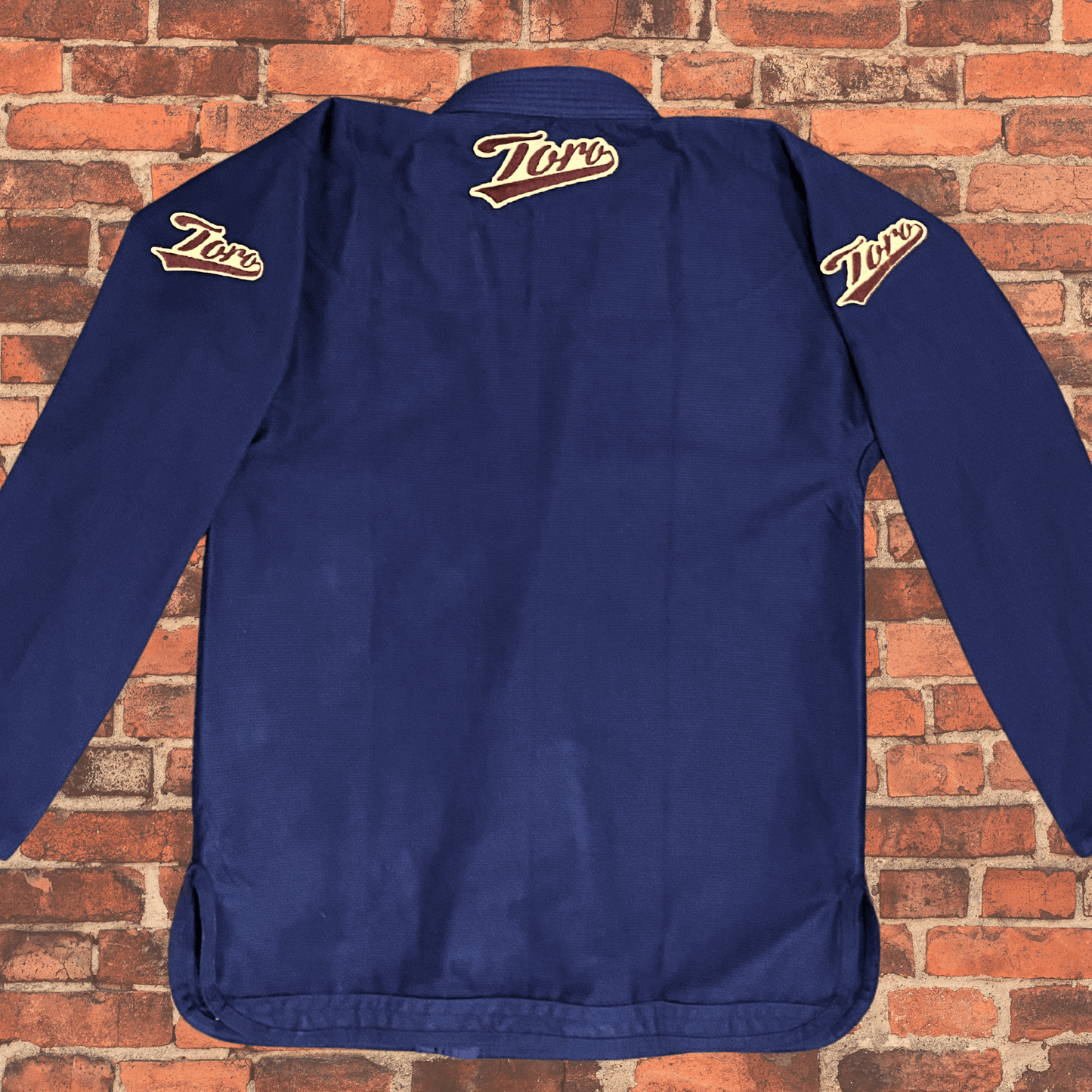 Navy Blue BJJ Gi jacket back view with Toro logo patches on shoulders and collar, Toro BJJ Coyote Gi