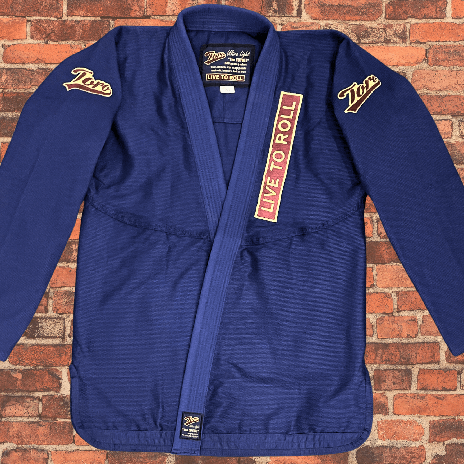 Navy Blue BJJ Gi jacket with Toro shoulder logos and Live to Roll patch, Toro BJJ Coyote Gi lightweight 380gsm