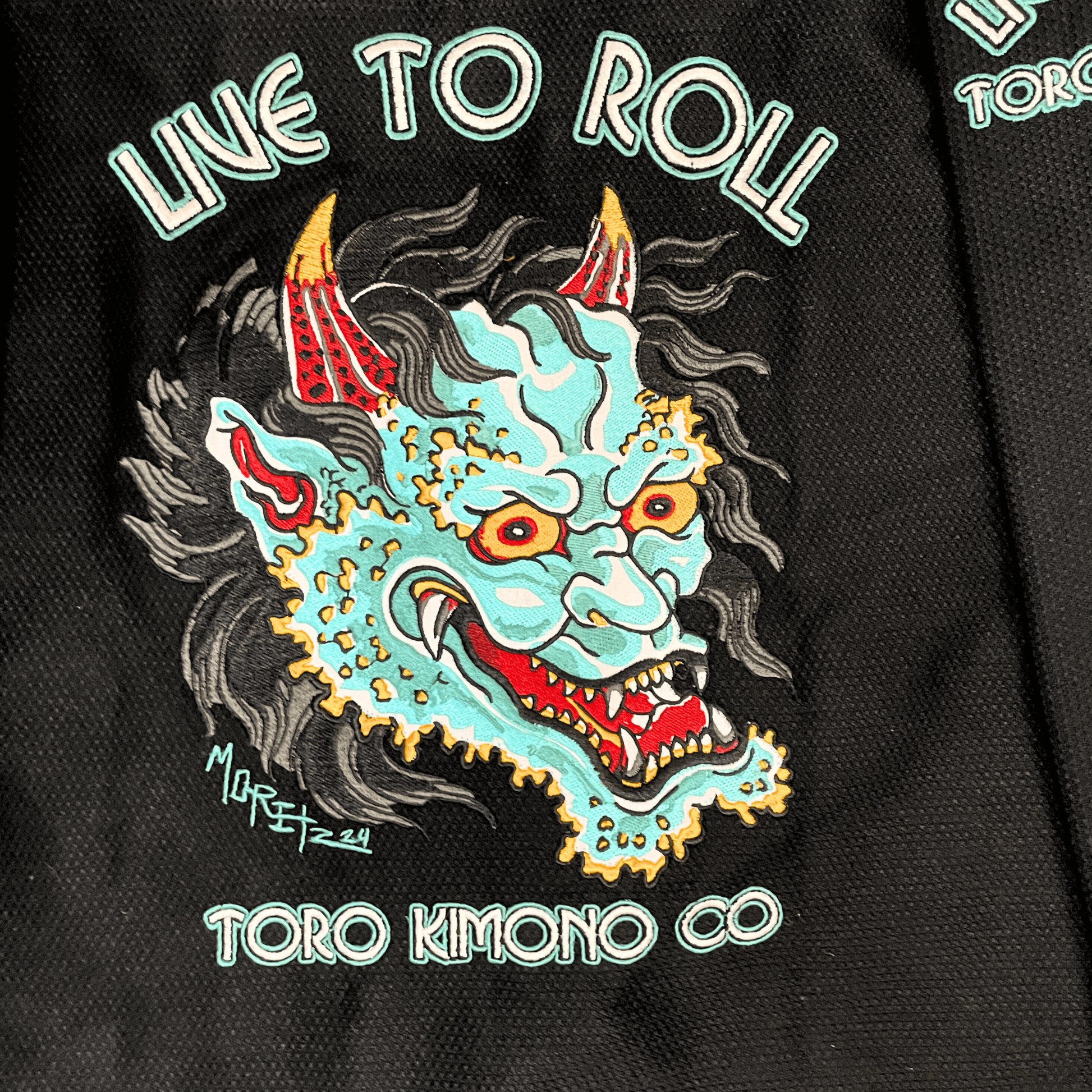 Green Oni BJJ Gi detailed Oni embroidery with Live to Roll text, IBJJF approved