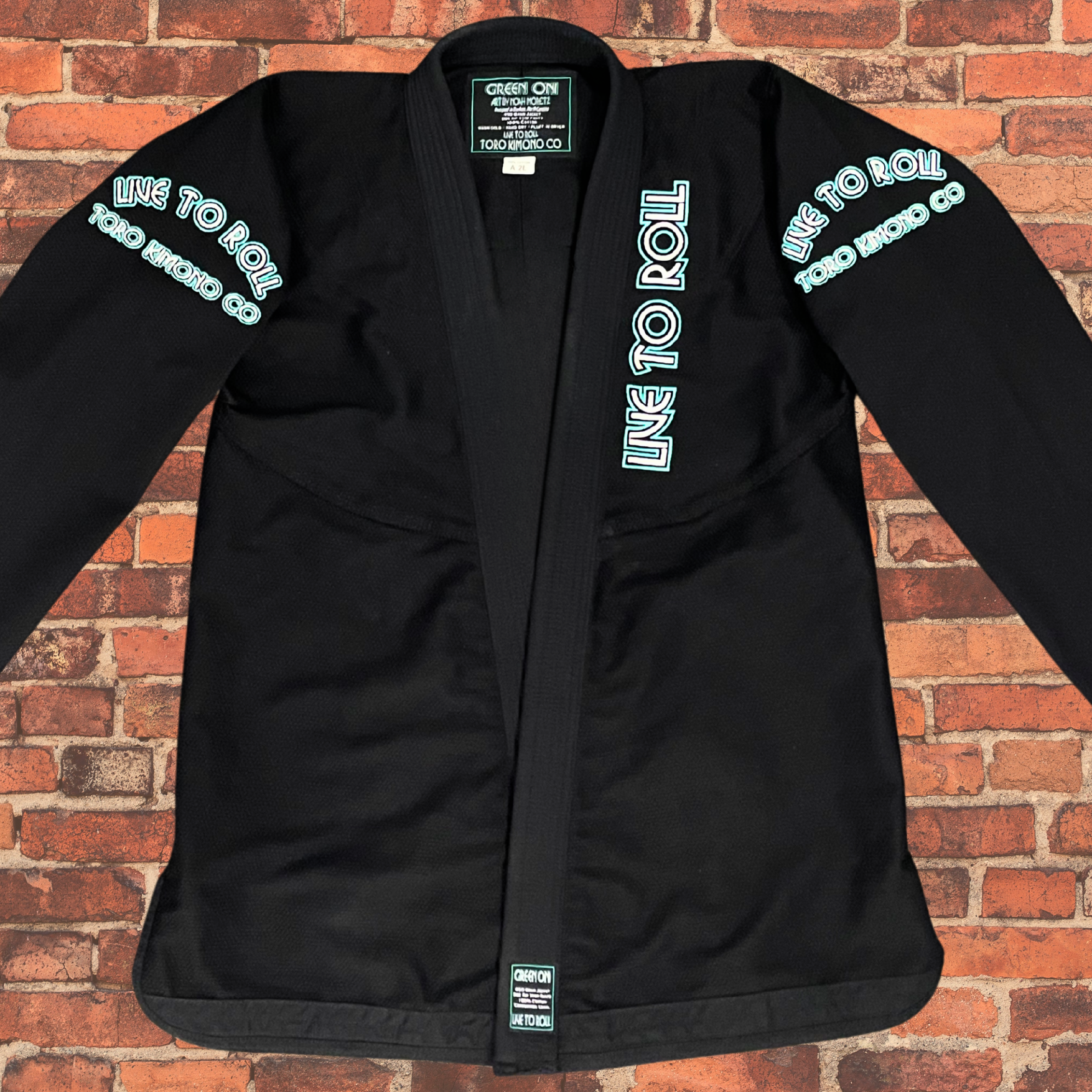 Green Oni BJJ Gi front view jacket with Live to Roll embroidery, IBJJF approved