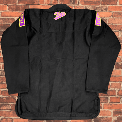 Back view of black BJJ Gi with Toro purple and gold logo and Live to Roll shoulder patches, IBJJF approved Purple & Gold Gi