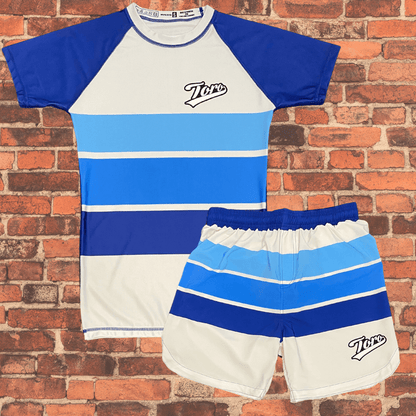 Toro BJJ Sand Shark NoGi Kit with matching striped rash guard and fight shorts in ocean blue and white tones.