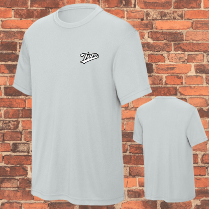 Front and back view of Toro youth grey belt loose fit BJJ rash guard on brick wall background
