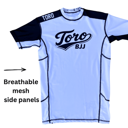 Toro white belt ranked rash guard with an arrow highlighting breathable mesh side panels