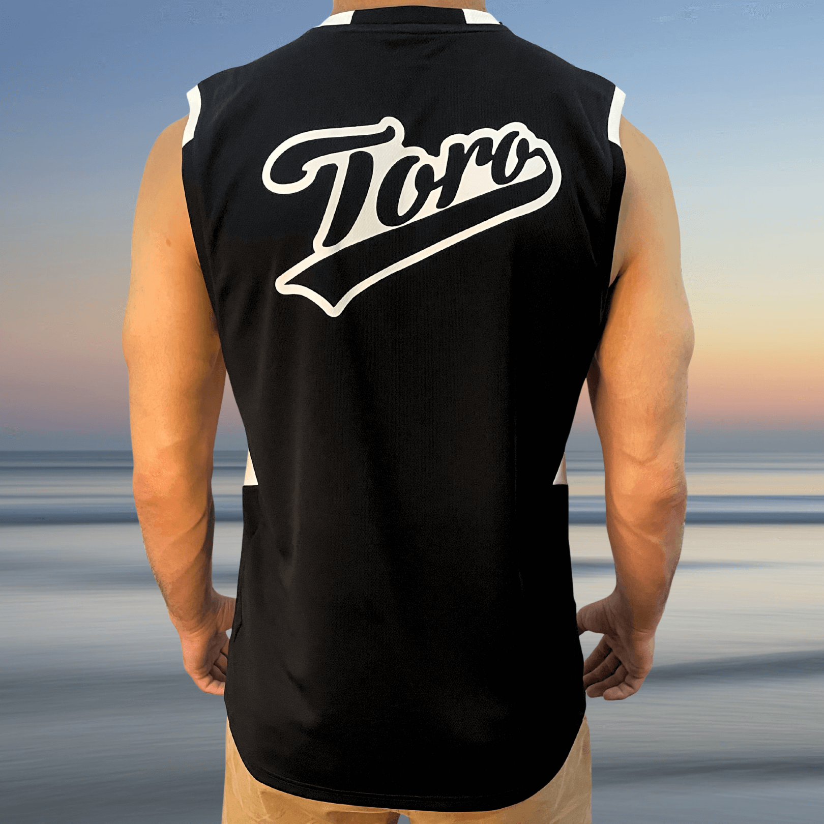 Back view of Toro Recycled Jersey worn by a man, featuring large white Toro script logo across shoulders
