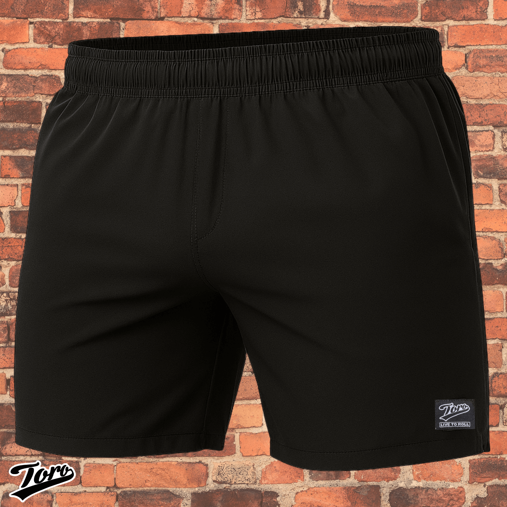 All black Toro BJJ Super Shorts against brick wall background, Black Label NoGi competition shorts.